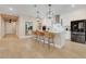 Open concept kitchen with island, modern pendant lighting and stainless steel appliances at 2161 Gold Dust Dr, Minneola, FL 34715