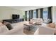 Bright living room featuring large windows, neutral colors, and stylish decor at 2161 Gold Dust Dr, Minneola, FL 34715