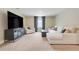 Spacious living room with modern entertainment setup and comfortable seating at 2161 Gold Dust Dr, Minneola, FL 34715