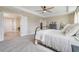 Serene main bedroom with access to a hallway, a connecting bath, and neutral walls at 2161 Gold Dust Dr, Minneola, FL 34715
