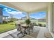 Outdoor patio with table and chairs, perfect for dining and relaxation at 2161 Gold Dust Dr, Minneola, FL 34715