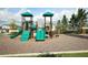 Community playground with slides, climbing structures, and play areas for active fun at 2161 Gold Dust Dr, Minneola, FL 34715