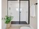 Modern shower with a glass enclosure and a rainfall showerhead at 2161 Gold Dust Dr, Minneola, FL 34715