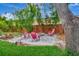 Backyard with a gravel firepit area and comfortable seating at 233 Largovista Dr, Oakland, FL 34787