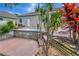 Backyard with a hot tub and lush landscaping at 233 Largovista Dr, Oakland, FL 34787