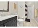 Well-lit bathroom featuring a vanity with dark wood cabinets and modern sink fixtures at 233 Largovista Dr, Oakland, FL 34787