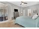 Serene bedroom with a comfortable bed and access to an outdoor patio at 233 Largovista Dr, Oakland, FL 34787