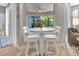 Charming breakfast nook with a round table and two chairs near a bright window at 233 Largovista Dr, Oakland, FL 34787