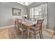 Elegant dining room with a wooden table, seating for six, and stylish decor at 233 Largovista Dr, Oakland, FL 34787