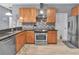 This kitchen has updated countertops, stainless steel appliances, and new flooring at 233 Largovista Dr, Oakland, FL 34787