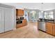 Bright, open kitchen with stainless steel appliances and dining area that flows into the living space at 233 Largovista Dr, Oakland, FL 34787