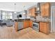 Stylish kitchen features stainless steel appliances, updated cabinets, and breakfast bar with seating at 233 Largovista Dr, Oakland, FL 34787