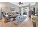 Cozy living room with comfortable seating and sliding glass doors to an outdoor patio at 233 Largovista Dr, Oakland, FL 34787