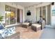 Cozy screened patio with comfortable seating, TV and serene views of the backyard at 233 Largovista Dr, Oakland, FL 34787