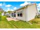 Spacious patio and sliding glass doors offer outdoor living at 2450 Merida Cir, The Villages, FL 32162