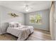 Bedroom features a ceiling fan, window, and sliding doors at 2450 Merida Cir, The Villages, FL 32162