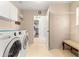 Laundry room with new washer, dryer, and convenient access to the rest of the house at 2450 Merida Cir, The Villages, FL 32162