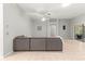 Spacious living room with a large sofa and sliding glass doors leading to an outdoor area at 2450 Merida Cir, The Villages, FL 32162