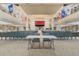 Spacious auditorium featuring tiered seating, stage, and natural light perfect for events and performances at 25400 Waterbrook Ct, Leesburg, FL 34748