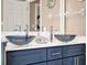 Up-close of bathroom's double vanity featuring modern vessel sinks, and chrome faucets at 25400 Waterbrook Ct, Leesburg, FL 34748