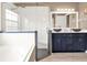 Bathroom features glass shower enclosure, soaking tub, and double vanity with vessel sinks at 25400 Waterbrook Ct, Leesburg, FL 34748