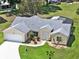 Lovely single-story home featuring manicured landscaping, neutral paint, and a two car garage at 25400 Waterbrook Ct, Leesburg, FL 34748