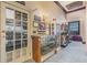 Charming hallway featuring a vintage display case and unique decor at 25400 Waterbrook Ct, Leesburg, FL 34748
