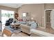 Comfortable living room area showcasing an open floor plan and luxury vinyl plank flooring at 25400 Waterbrook Ct, Leesburg, FL 34748