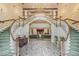 Elegant lobby with grand staircase, chandelier, and reception area, exuding sophistication and style at 25400 Waterbrook Ct, Leesburg, FL 34748