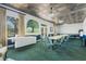 Bright meeting room with ample seating, natural light, and a treed view at 25400 Waterbrook Ct, Leesburg, FL 34748