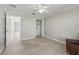 Clean bedroom with light wood floors, white trim, closet and bright walls at 2620 Persimmon Loop, The Villages, FL 32162