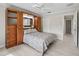 Bright bedroom featuring built-in storage units and a view of the outdoors through a window at 2620 Persimmon Loop, The Villages, FL 32162