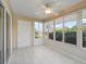Bright Florida room featuring tile flooring, abundant windows, and views of the surrounding landscape at 2620 Persimmon Loop, The Villages, FL 32162