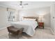 Serene main bedroom with neutral decor, ceiling fan, and natural light, creating a relaxing retreat at 2620 Persimmon Loop, The Villages, FL 32162