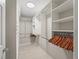 Well-organized walk-in closet with ample shelving and hanging space for optimal storage at 2620 Persimmon Loop, The Villages, FL 32162