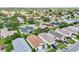 An aerial view of a residential neighborhood with lush green lawns and varying home designs at 2746 Edwards Ln, The Villages, FL 32162