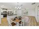 Dining area adjacent to the kitchen, showcasing modern decor and an open floor plan at 2746 Edwards Ln, The Villages, FL 32162