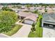 An aerial view of a single-story home featuring well-manicured landscaping and a private driveway at 2746 Edwards Ln, The Villages, FL 32162