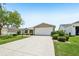 Charming single-story home with a well-maintained front yard and two car garage at 2746 Edwards Ln, The Villages, FL 32162