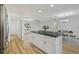 Spacious kitchen island complemented by a view into the nearby dining and living areas at 2746 Edwards Ln, The Villages, FL 32162