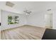 Bright living room with a large window and modern flooring, perfect for a cozy ambiance at 2746 Edwards Ln, The Villages, FL 32162