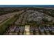 Aerial real estate view of a two-story home with a landscaped lawn in an attractive community location at 2755 Bobcat Chase Blvd, Oakland, FL 34787