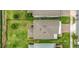 Aerial view of the property featuring a manicured backyard with outdoor furniture and an extended screened-in patio at 2755 Bobcat Chase Blvd, Oakland, FL 34787