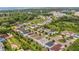 Aerial view of the neighborhood showcasing lush greenery, well-maintained homes, and community landscaping at 2755 Bobcat Chase Blvd, Oakland, FL 34787
