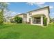 Spacious backyard with a screened patio, perfect for outdoor living and enjoying the peaceful surroundings at 2755 Bobcat Chase Blvd, Oakland, FL 34787