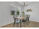 Bright dining room with natural light and modern black and wood dining set at 2755 Bobcat Chase Blvd, Oakland, FL 34787