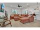 Spacious living room featuring a large sectional sofa and hardwood floors at 2755 Bobcat Chase Blvd, Oakland, FL 34787