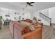 Bright, open-concept living room seamlessly connecting to the kitchen and dining area at 2755 Bobcat Chase Blvd, Oakland, FL 34787