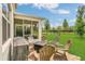 Inviting outdoor patio with a fire pit, grill, and comfortable seating area at 2755 Bobcat Chase Blvd, Oakland, FL 34787
