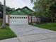 Inviting single-Gathering home featuring an attached garage and a well-maintained front yard at 2842 Ithaca Ct, Orlando, FL 32826